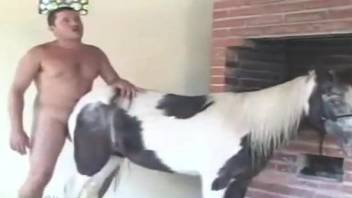 Dude with a large dick banging a submissive animal