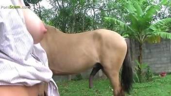 Blonde in leopard print clothes sucks on a stallion's cock