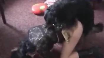 Boots-wearing brunette getting fucked by a filthy dog