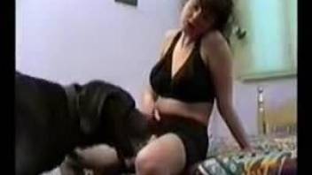 Cute and obedient dog is licking that hairy mature pussy