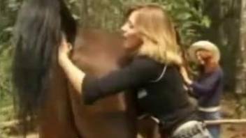 Two kinky girlfriends take turns fucking a horse