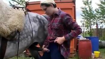 Round faced bitch worships a horse's hard cock