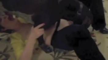 Tattooed woman being screwed by a filthy beast and a lustful man